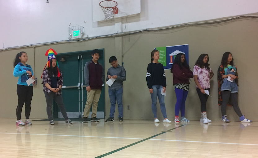 Candidates for 2019 class secretary Tiffany Zhao (10), Cindy Wang (10), Richard Wang (10), Jason Huang (10), Alycia Cary (10), Mahi Gurram (10), Meghna Phalke (10) and Elizabeth Yang (10) look on as class dean Chris Florio addresses the sophomores. Alycia was announced as the winner of the election via an email announcement from Mr. Florio today.