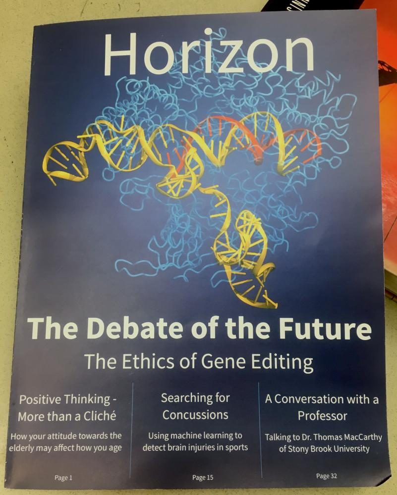 Science teacher and Harker Horizon adviser Chris Spenners classroom copy of the first issue of Harker Horizon rests on a textbook. The issue, released last week, features science writing from current and past upper school students.