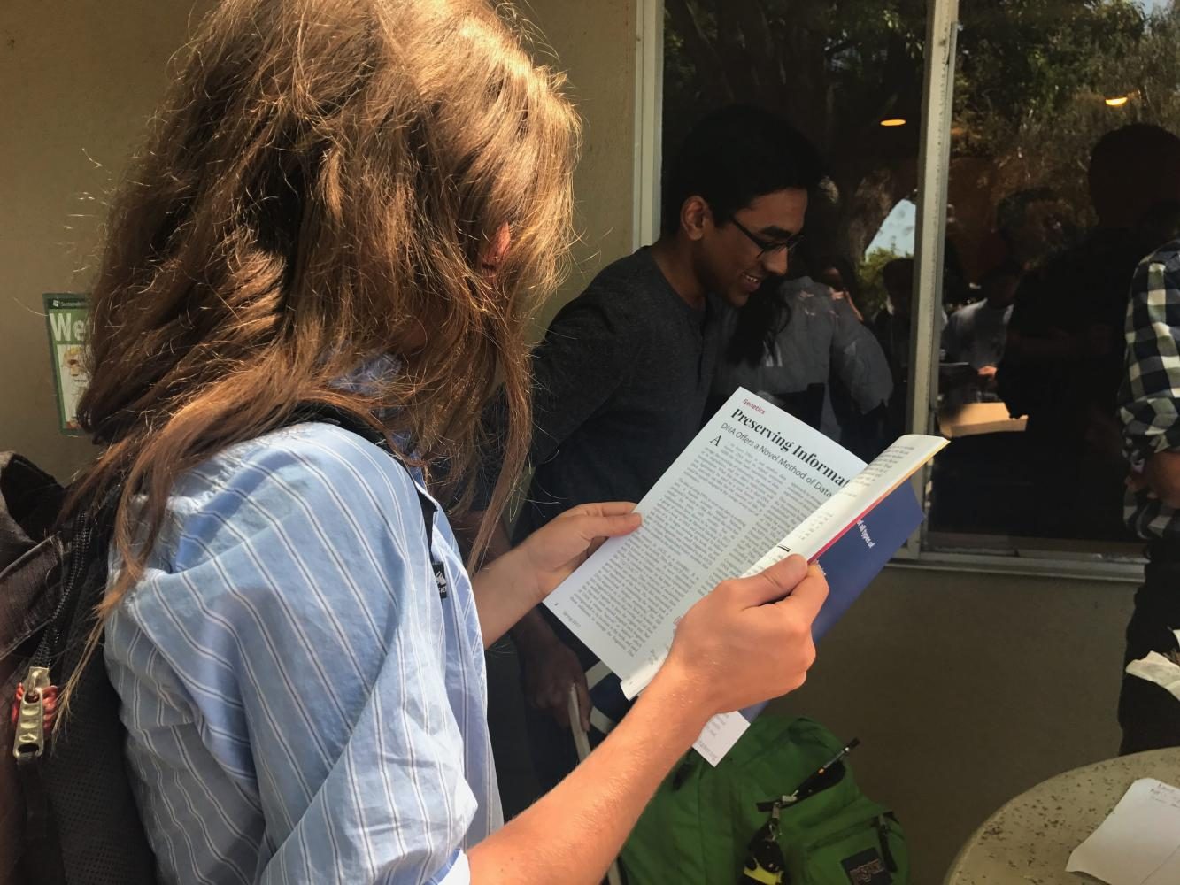 Andrew Semenza (11) reads Harker Horizon outside Manzanita during lunch. This issue of the journal, containing student articles and projects, was released on May 8.