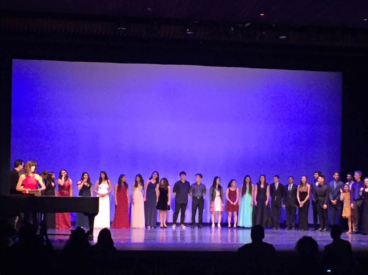 The performing seniors line up across the stage at the end of yesterdays Senior Showcase to receive their certificates of completion from faculty members of Harkers performing arts department. The event was held at Foothill Colleges Smithwick Theater from 7 to 9:30 p.m.