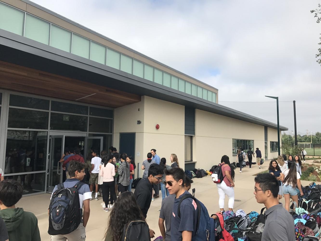 Students and faculty gather outside the athletic center before the start of todays school meeting. The next school meeting of the year will be on Tuesday, Sept. 5.