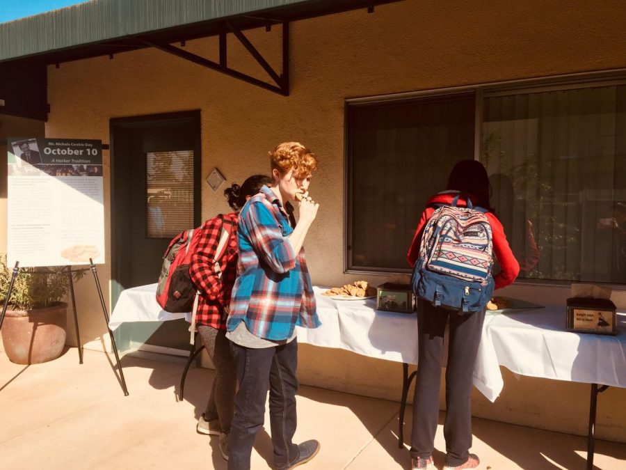 Students enjoy a treat of chocolate chip cookies outside the Main office to celebrate former Head of School Howard Nichols birthday. Another table of cookies was stationed outside the Singh Aquatic Center.
