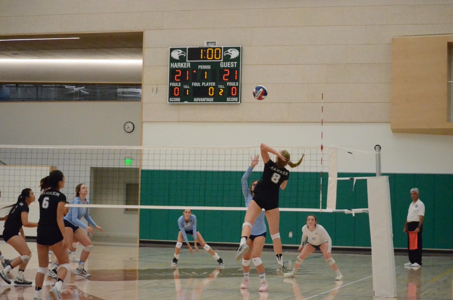 Isabella Spradlin (12) faces two Valley Christian blockers as she jumps to hit the ball over the net. The teams next game is their league opener against Sacred Heart Preparatory next Thursday.