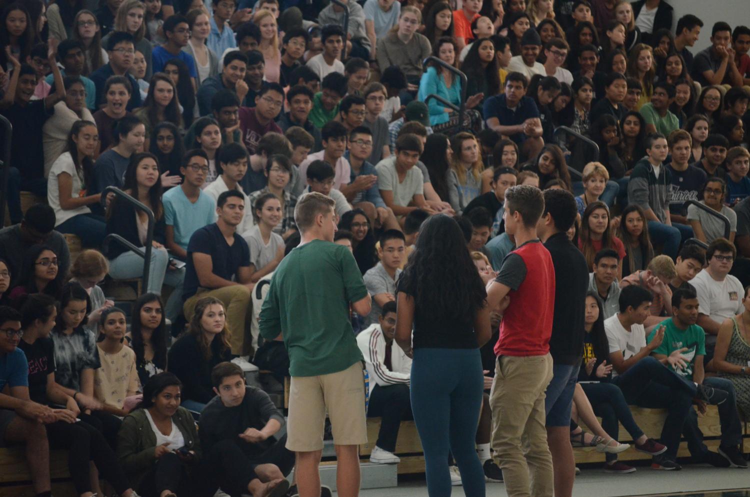 Jared Anderson (11), Mahi Gurram (11), Anthony Meissner (11) and Matthew Hajjar (11) deliver Harker Athletics' weekly Eagle Update at today's school meeting. They played a video of the varsity girls' volleyball team's game against Lynbrook High School on Aug. 29.
