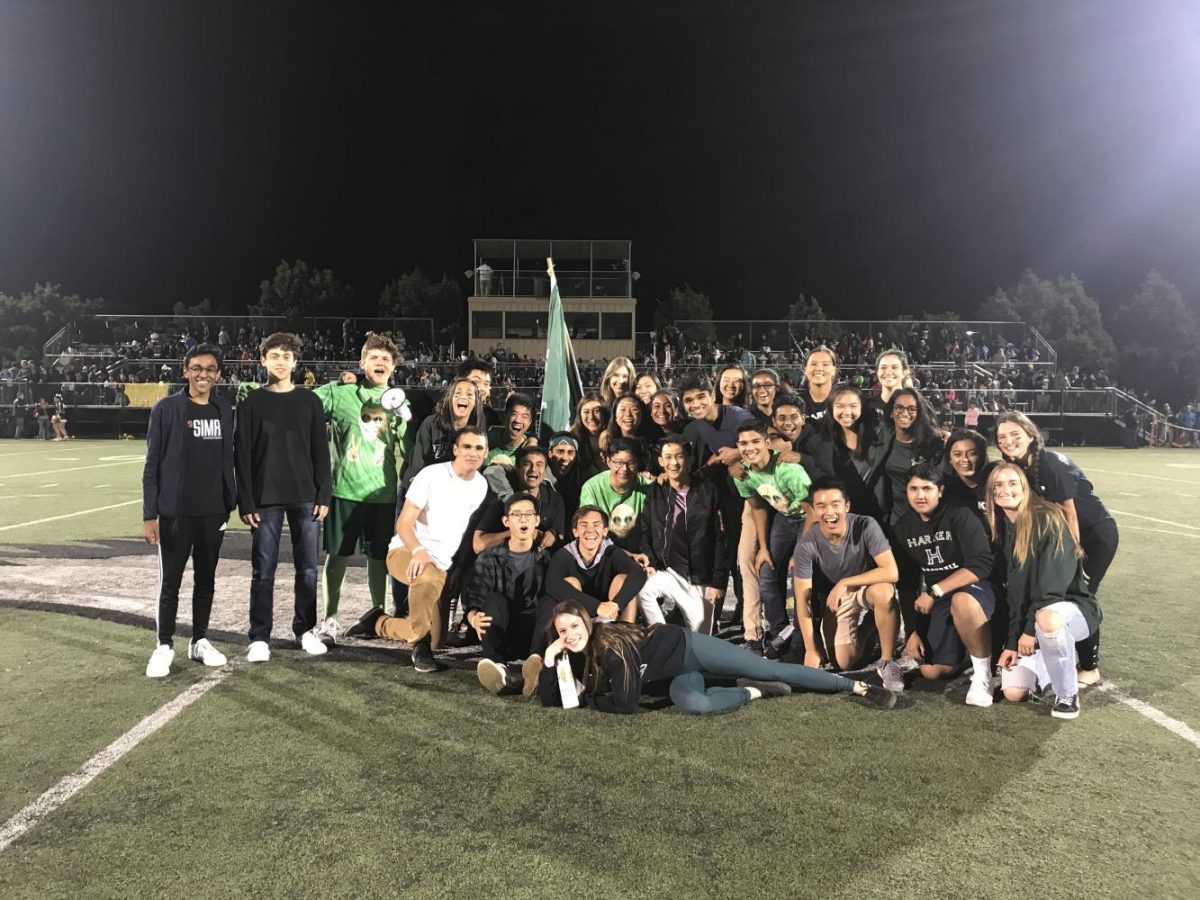 Members of the Class of 2018 pose for a group photo with their class flag on Davis Field during this years Homecoming game. 