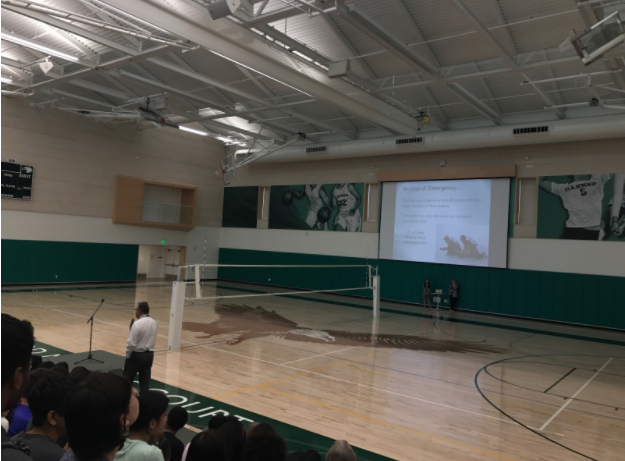 Students listen as Assistant Head of School Greg Lawson discusses campus drop-off points during todays school meeting. Lawson also reminded students and faculty of an upcoming emergency drill and reviewed proper evacuation protocol.