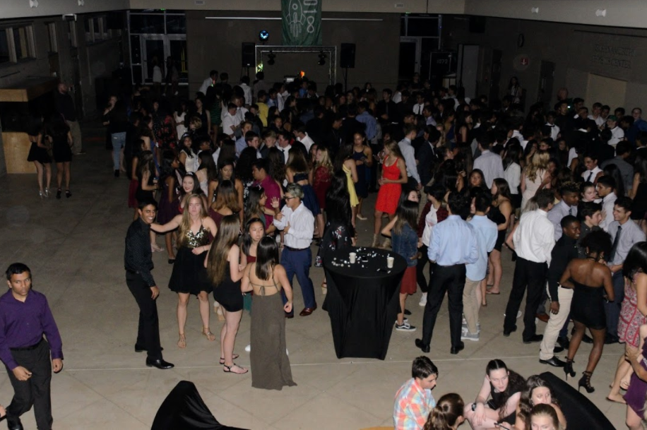 Students+crowd+onto+the+dance+floor+for+Cupids+Cupid+Shuffle.+The+DJ+also+played+DJ+Caspers+Cha-Cha+Slide+during+tonights+dance.