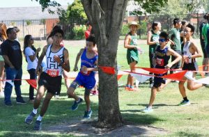 Aditya Singhvi (9) runs in a cross country meet. He began running in middle school.