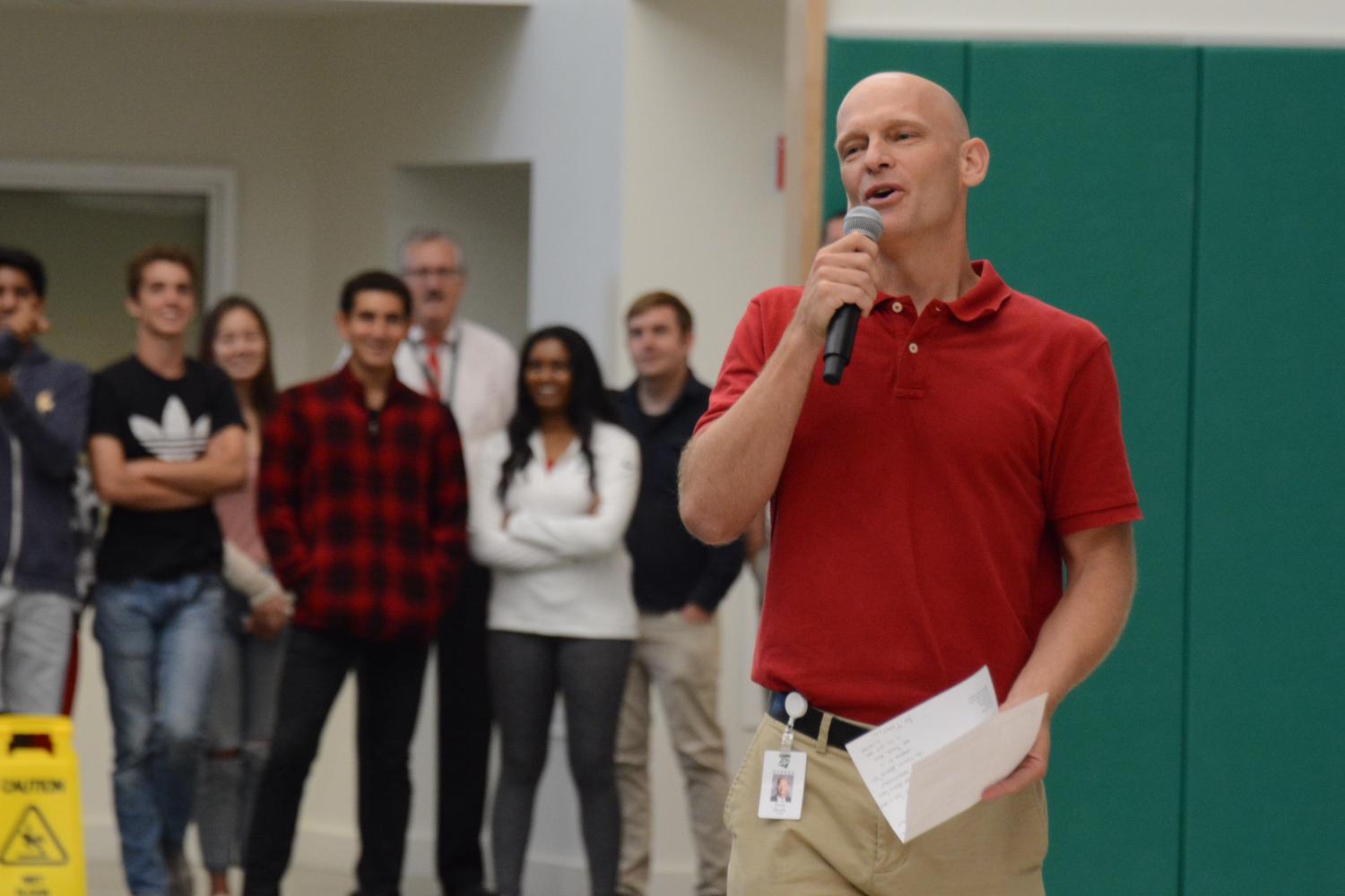 Academic Dean Evan Barth delivers a short speech about former Head of School Howard Nichols' life during today's school meeting.