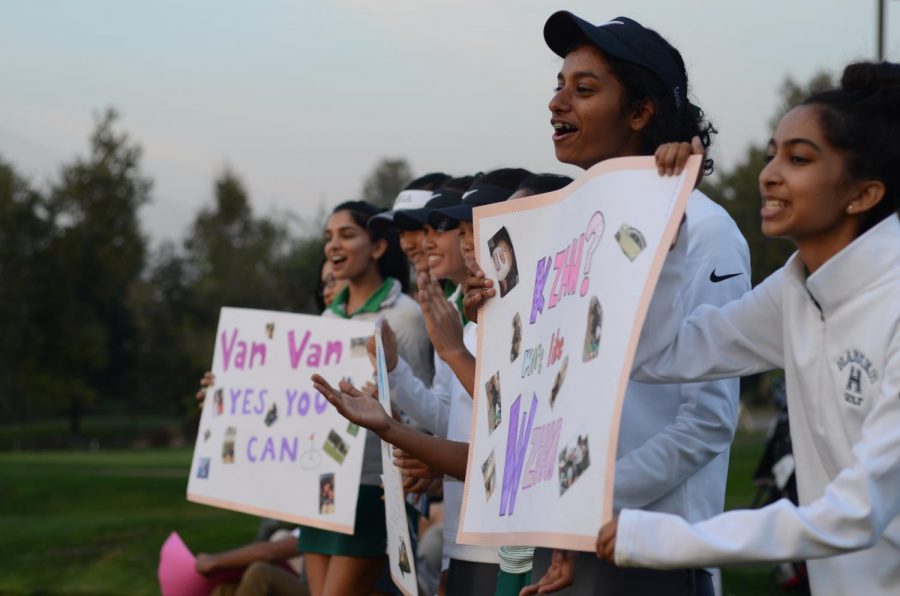 The team cheers for the seniors as they shoot the last holes. The varsity girls golf team won their senior night match against Sacred Heart Preparatory 186-262.
