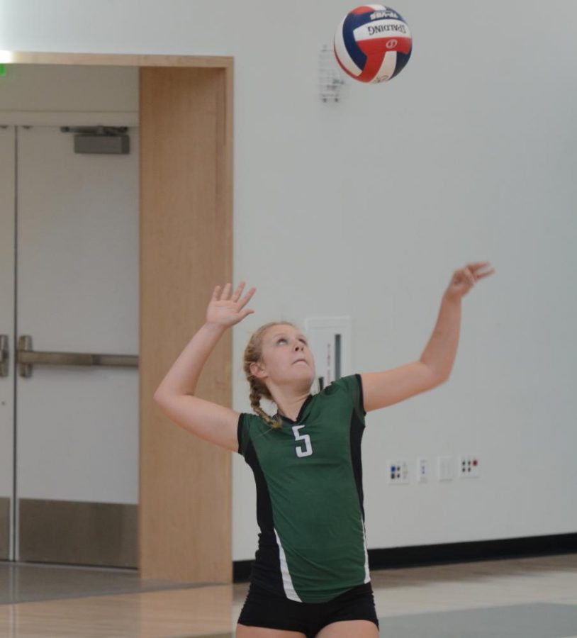 Co-captain Hannah Sobczyn (9) serves the ball to Sacred Heart Prep. During the match, the team only missed one serve. 