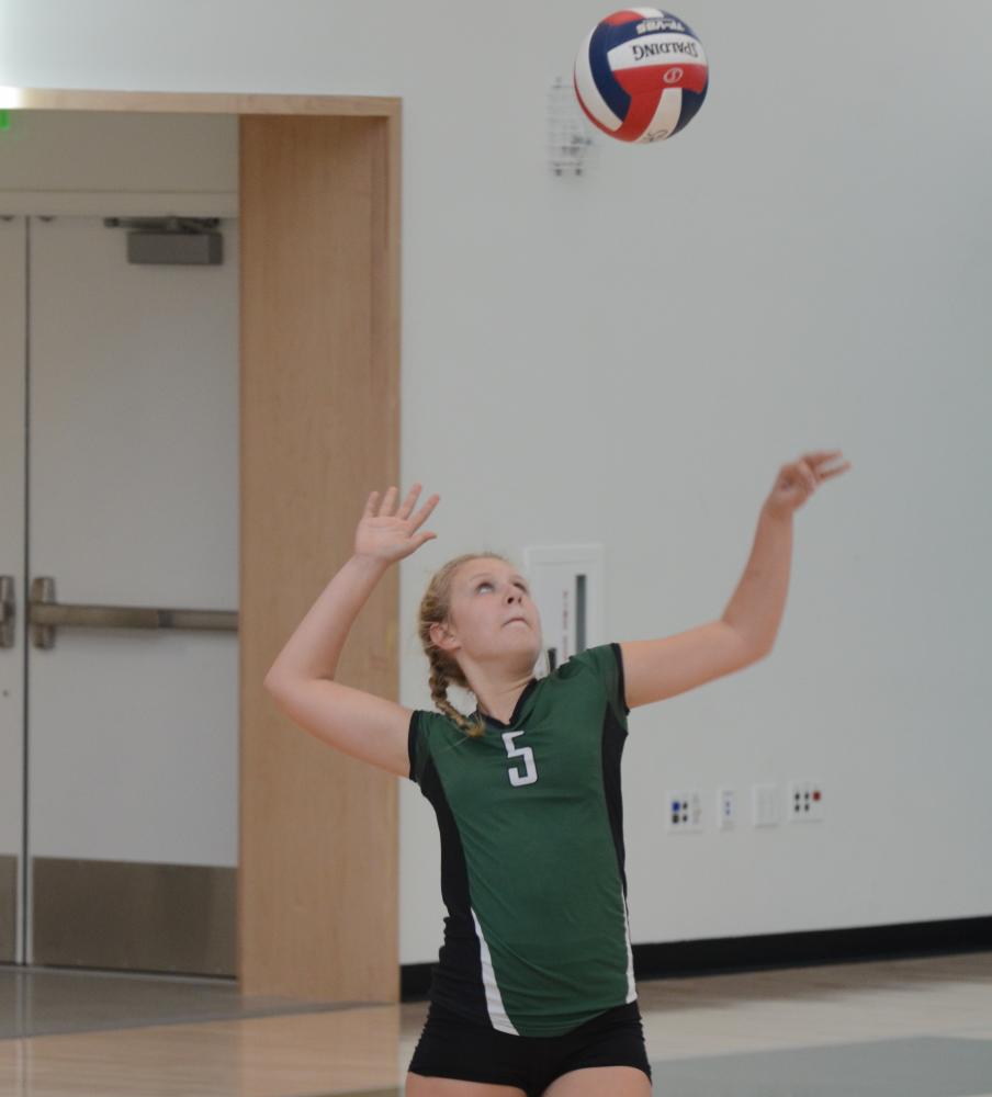 Co-captain Hannah Sobczyn (9) serves the ball to Sacred Heart Prep. During the match, the team only missed one serve.