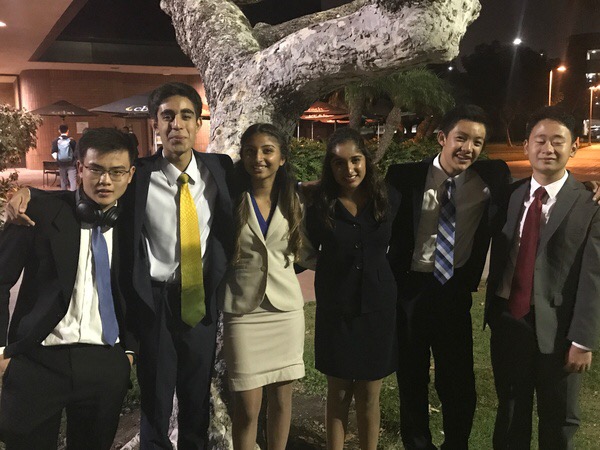 Members of the speech and debate team at the Jack Howe Memorial Tournament pose for a photo after their first day of competing at the invitational. The tournament took place on Sept. 30 and Oct. 1.