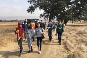 A group of freshmen walk along a trail to their next trail repair site at the Coyote Valley Open Space Preserve. “I’m most looking forward to… getting the opportunity to see my advisees get closer together. [If] we get out there and put in some sweat and some elbow grease into this project, I can’t imagine something that would make us bond more closely together, freshman advisor Scott Odekirk said before the trip.