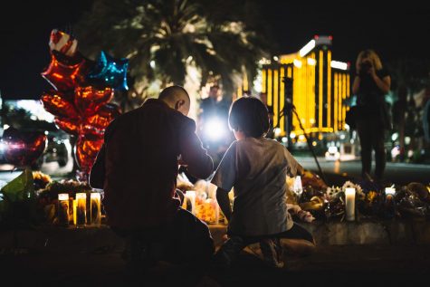 Across the site of the festival, people visit a makeshift memorial, one of several that have been set up in the last week in the wake of the shooting. Fifty-eight people were killed and at least 527 were injured.