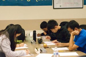 Math Club members work on practice problems for the Princeton University Mathematics Competition. The competition will take place on Nov. 18.