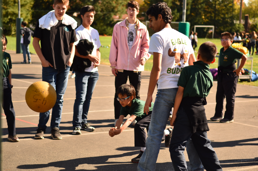 Chris Leafstrand (11), Chris Gong (11), Charlie Molin (11) and Sukrit Ganesh (11) look on as their Eagle Buddies play a game of wallball. The juniors traveled to the Bucknall campus to meet with their Eagle Buddies today.