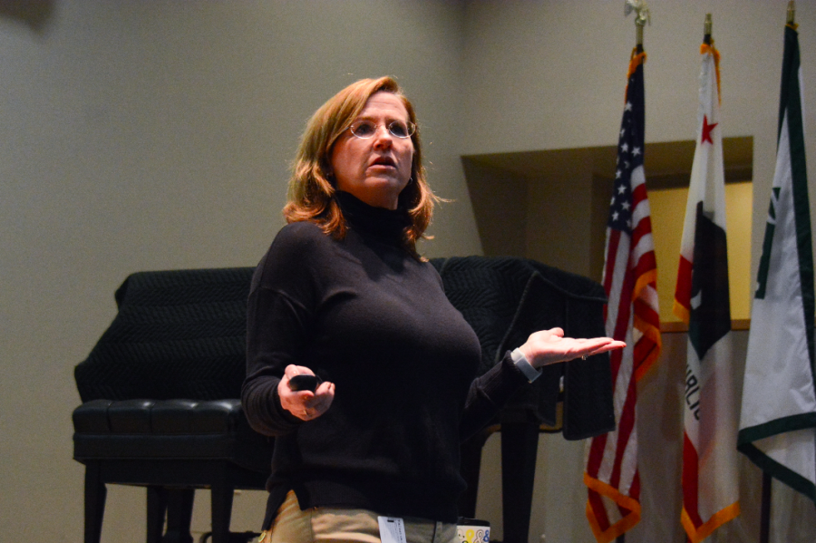 Mathematics teacher Jane Keller welcomes the sophomores to their LIFE assembly in Nichols Auditorium. Throughout the year, freshmen attend around five LIFE meetings, while there are only two or three meetings held for sophomores.