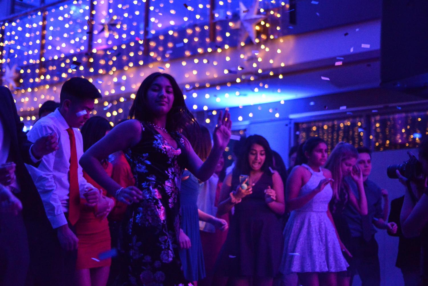 Sana Pandey (10) does the cha-cha to a mix of music from the DJ. Winter Ball took place on Jan. 20 in the Nichols Atrium.