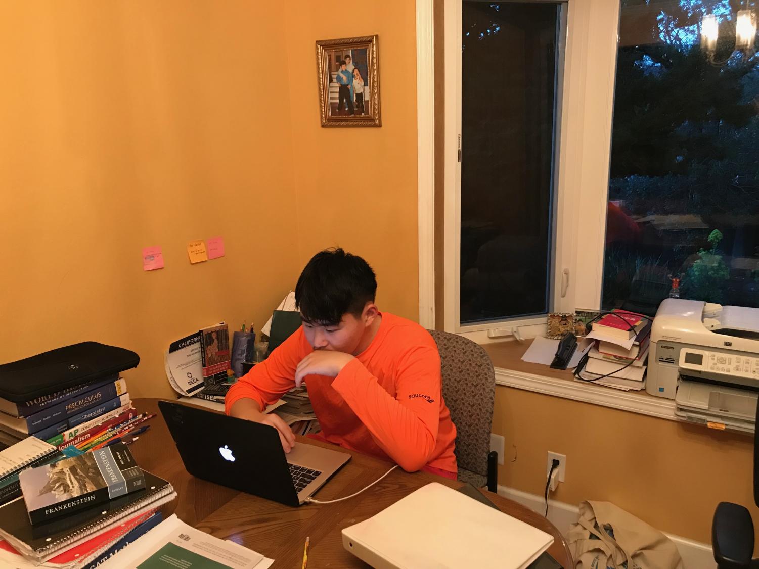 Jessie Wang (10) works at his laptop on homework. Jessie started attending Harker in his sophomore year.