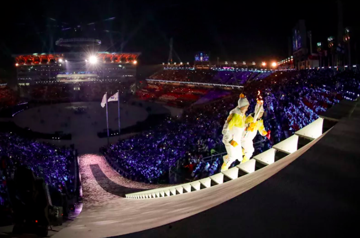 North Korea’s Jong Su Hyon and South Korea’s Park Jong-ah light the Olympic Cauldron during the opening ceremony. Unprecedented unification between the two Koreas was seen during the Olympic games. 