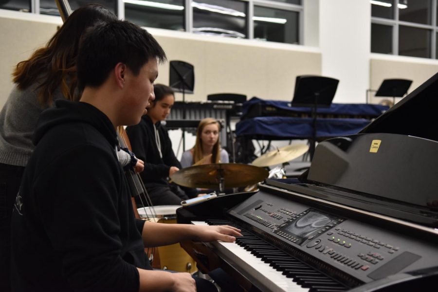Upper school instrumentalists practice in one of the rehearsal spaces of the center. The facility also includes a series of dressing rooms.