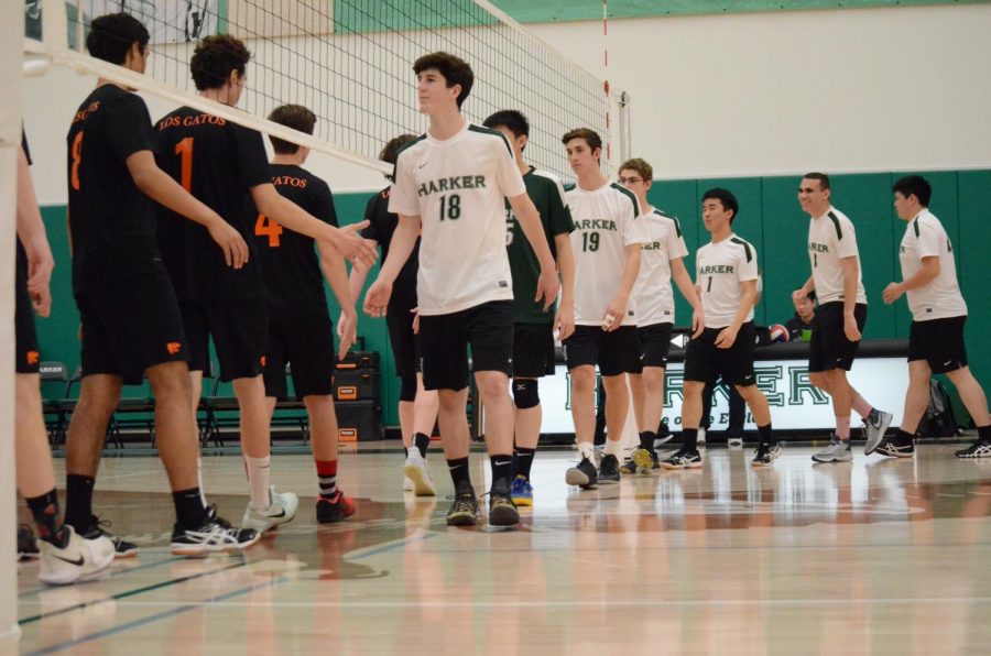 Before the game against Los Gatos High School, the boys volleyball team high fives their opponents. This was the first boys volleyball match played in the new Athletics Center.