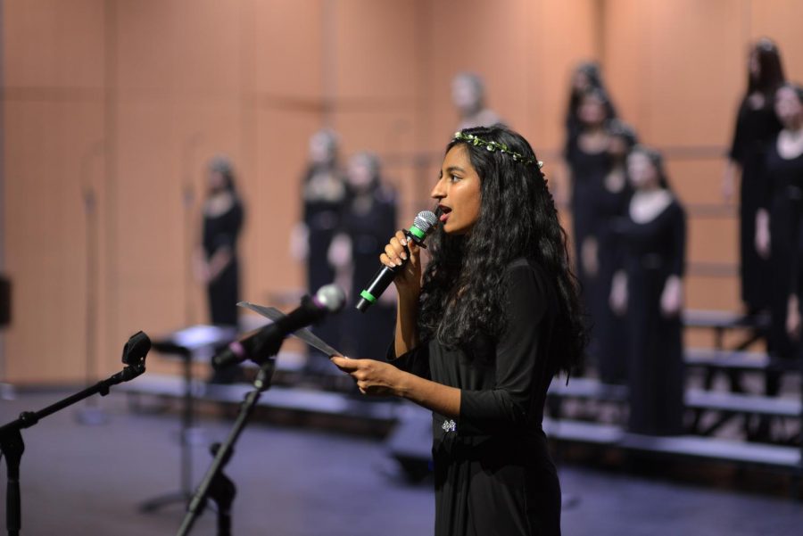 Sumati Wadhwa (12) announces the upcoming performances of the concert before performing in Cantilena. The audience members joined the performers on stage for a rendition of the Harker School Song at the end of the concert.