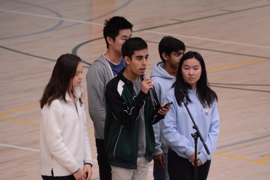 Student council members  Alycia Cary (11), David Wen (12), Avi Gulati (10), Akshay Manglik (9) and Kat Zhang (11) announce details about the upper schools upcoming support and advocacy initiatives in response to the recent Marjory Stoneman Douglas (MSD) shooting. Among these efforts include an optional vigil in the athletics center this Wednesday and a gun debate and town hall at 3:15 p.m. in Nichols Auditorium on March 23.