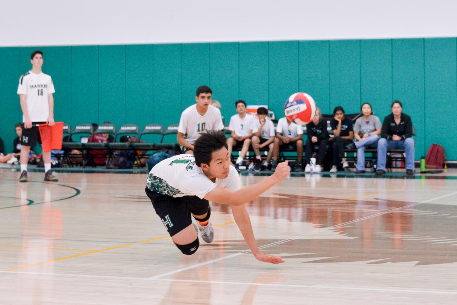 Sophomore David Feng dives for a ball during the game against Cupertino High School. The team has eight games left in their season.