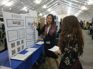 Ellen Guo (12) presents her project to a judge at the 2018 Synopsys Science Fair.  The fair has gone virtual in response to the CDCs advisory against mass gatherings.