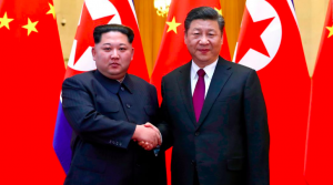 North Korean leader Kim Jong Un and Chinese President Xi Jinping shake hands after a separate meeting of theirs in March. Kim traveled unannounced to Beijing by train last month for another meeting with Chinese officials.