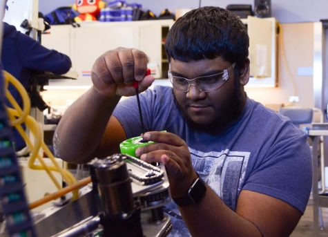 Humans of Harker: Sunny Jayam solves problems in the robotics lab