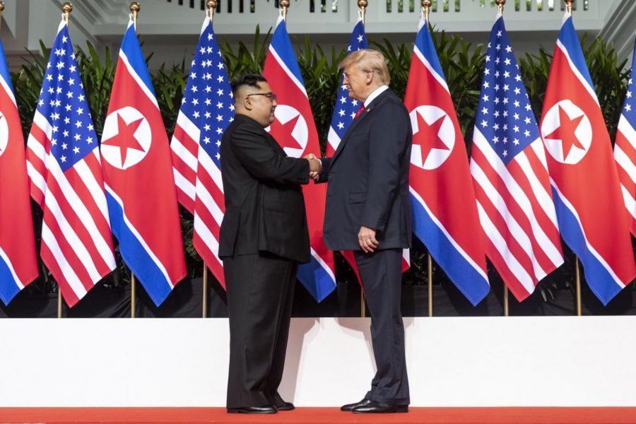 Donald Trump and Kim Jong Un shake hands at the beginning of their summit in Singapore.