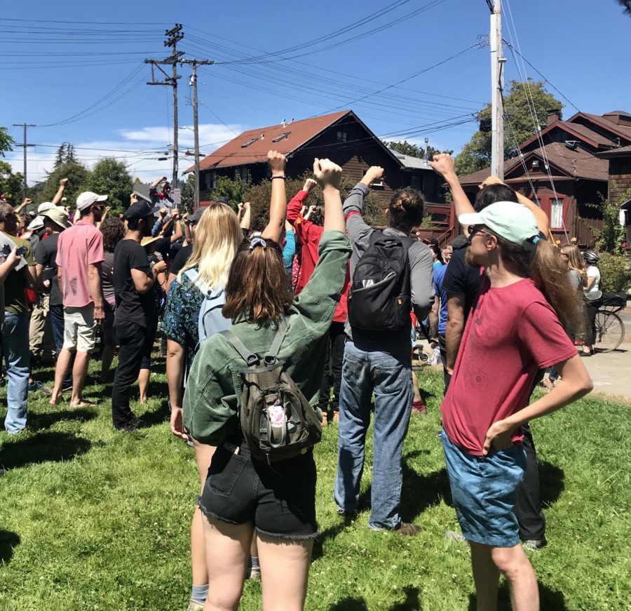 Counter-protesters raise their fists at the “No to Marxism in America 2” rally in Berkeley on Aug. 5. “[The counter protest is] about making sure that working class people have solidarity,” said Khawer Khan, one of the counter-protesters.