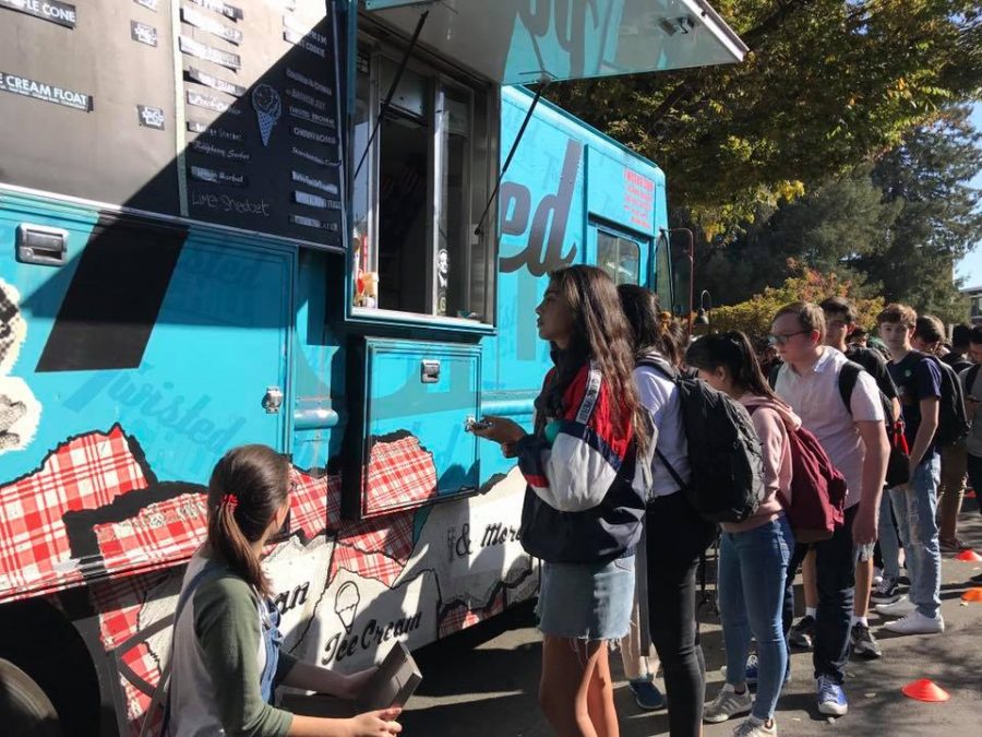 Students line up to purchase ice cream from the Twisted Chill truck today after school. The truck stopped by the upper school today. 
