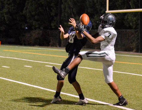 With about two minutes remaining in the first quarter, Siddharth Dudyala (11) catches a 37-yard pass from quarterback Anthony Meissner (12) to advance the ball to the Lobos' 2-yard line. Although a Lobos interception thwarted Harker from converting from the red zone, they still ended the first half with a 21-0 lead.