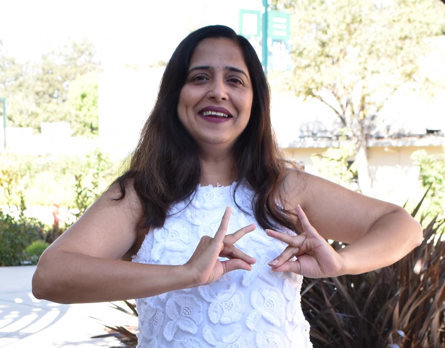 Gesturing with her hands, computer science teacher Anu Datar shows an Indian dance move. “I feel that dance actually makes me a better teacher because when I go to my dance teacher, and she teaches me something really complicated, I realize that it takes a while to master something,” Datar said. “So I think I developed empathy toward students who were struggling with things in class because I myself experience that when I go dance.”