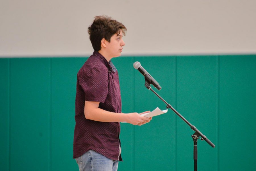 Raphael Sanche (12), GSA president, gives a speech about his experience coming out as transgender in honor of National Coming Out Day on Oct. 11.
