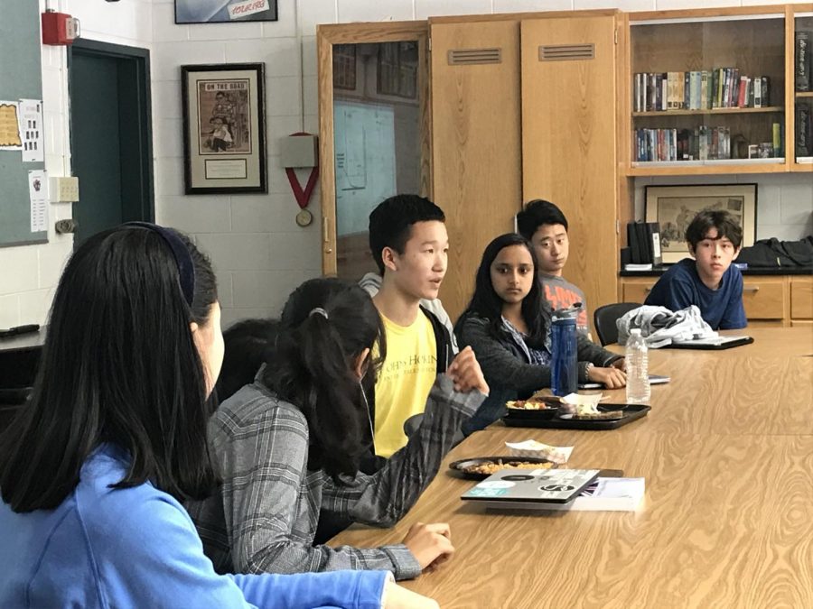 Six sophomores, including Ethics in Technology Forum co-founders Sidra Xu and Jason Lin, engage in discussion around a table. The first Ethics in Technology meeting was held on Sept. 27.
