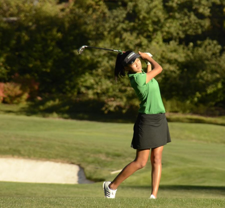Olivia Guo (10) watches on after hitting the ball. Led by captain Katelyn Vo (11), the girls won a convincing 196-261 victory. Freshman Sophie Zhang Murphy shot par at 36, Katelyn followed with a 39 and Natalie Vo (10) and Olivia both shot 40.