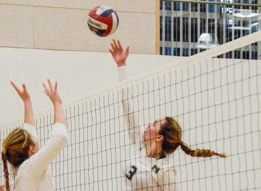 Lauren Beede (11) reaches up to tap the ball over the net in todays CCS semifinals game against Santa Cruz High School. The game was held at Menlo High School and was carried by the Harker varsity girls team, who will proceed to play Notre Dame High School in the finals game on Saturday.
