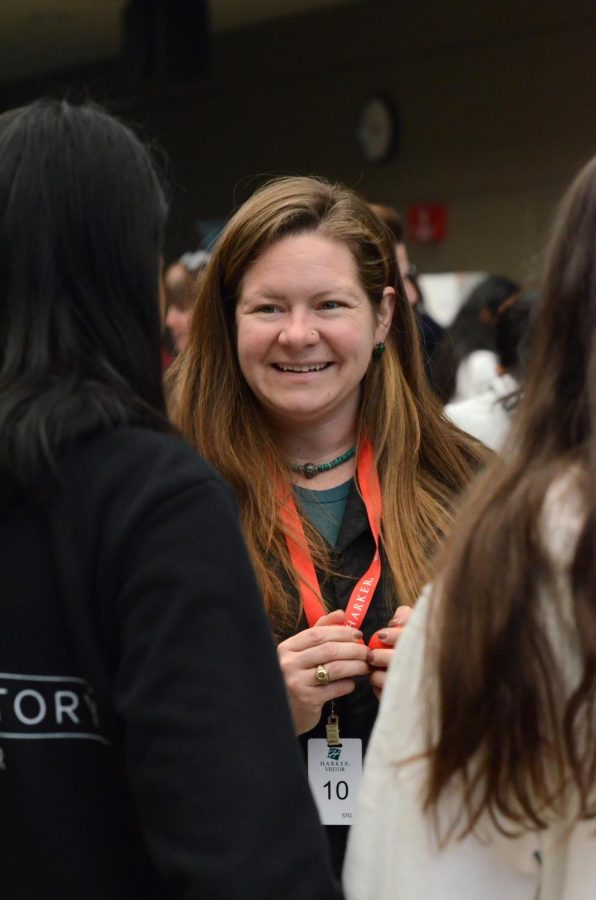 A representative greets students at this years Service Fair on Nov. 12. “The exciting thing about the fair is that there are organizations that represent a huge diversity of ways to do service,” organizer Mike Pistacchi said.