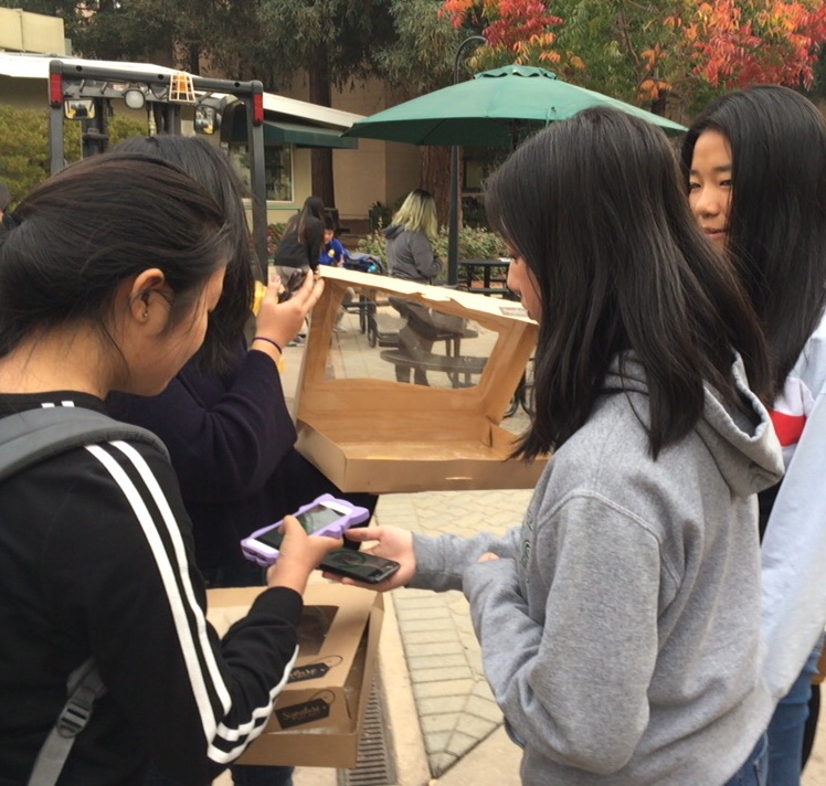 Luisa Pan (10) sells donuts on Oct. 13 for Harker Horizon's club week. The club, a science magazine, sold donuts and popcorn chicken to raise money for their club last week.