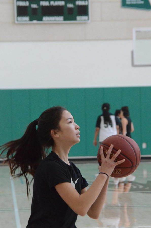 Cindy Su (9) shoots during practice. The team dominated the University Prep Academy’s Golden Eagles in a 41 point win in their first game of the season.