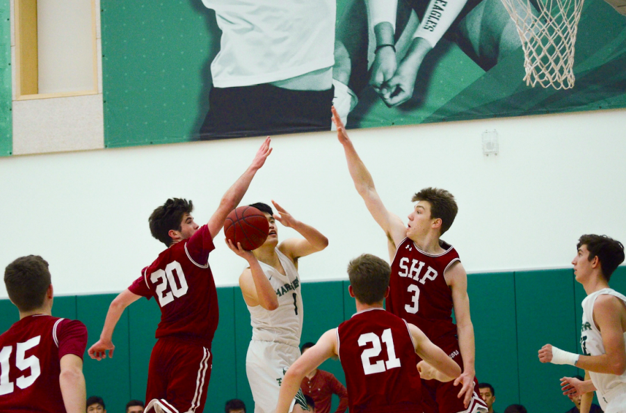 Gene Wang (12) scores in traffic. The Eagles next play at Crystal Springs on Tuesday, Jan. 29 at 7:30 p.m. 