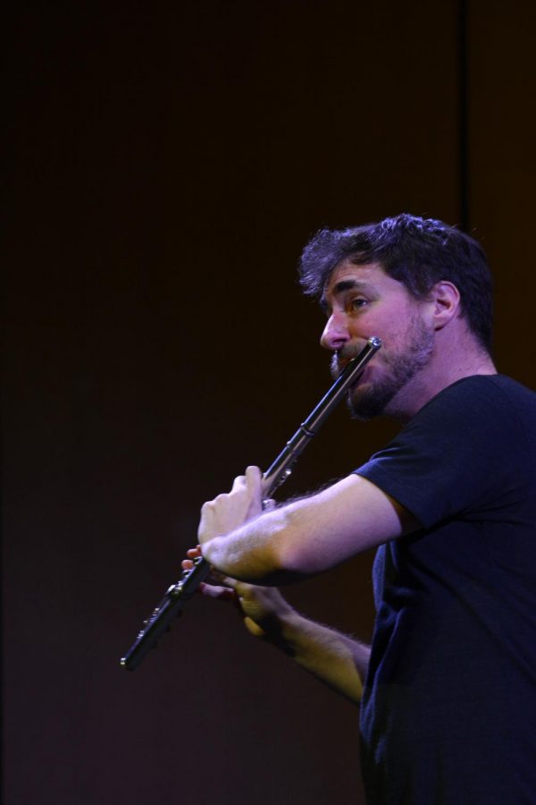 Greg Pattillo beatboxes using his flute at the PROJECT Trio concert yesterday.  The trio's concert included their versions of classic songs as well as original pieces.