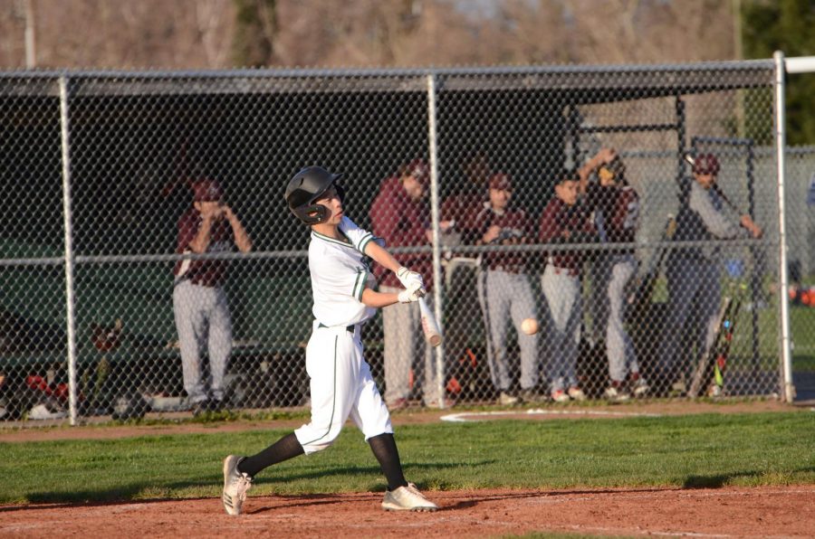 Austin Wang (9) swings at a pitch. The boys next play at Prospect High School next Wednesday at 3:30 p.m.
