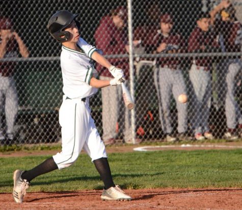 Austin Wang (9) swings at a pitch. The boys next play at Prospect High School next Wednesday at 3:30 p.m.