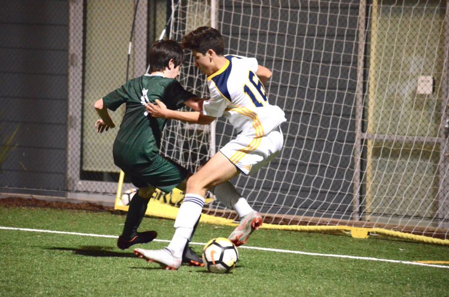 Marcos Acero (10) tussles for the ball during the varsity game. The junior varsity team succumbed to Menlo 4-0. 